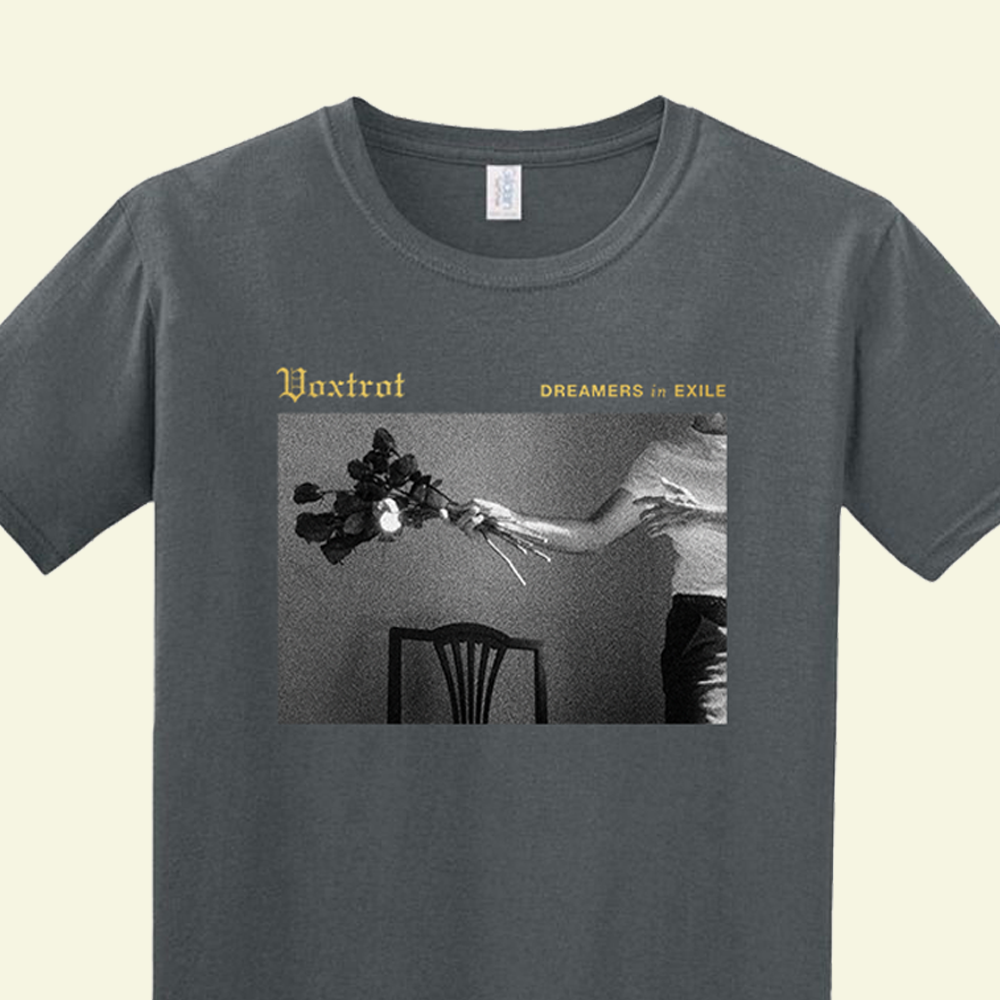 Gray t-shirt with a graphic design and text on a beige background