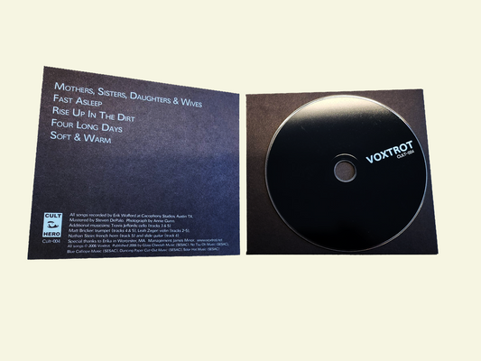 CD with cover displaying album tracklist on a beige background